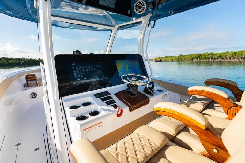 Slide: The Image of 2027 Sportsman Open 352 Center Console boat interior with modern dashboard and luxurious seating. - 23