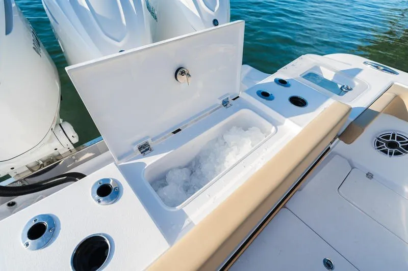 Slide: The Image of 2027 Sportsman Open 352 Center Console boat with open ice compartment on deck. - 19