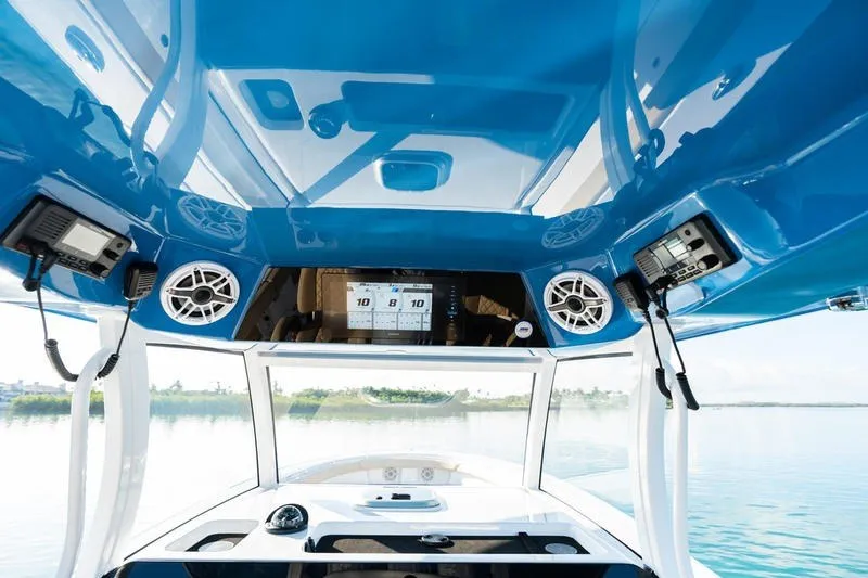 Slide: The Image of 2027 Sportsman Open 352 Center Console boat interior with advanced navigation and audio systems. - 37