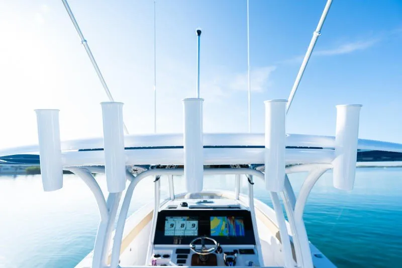 Slide: The Image of 2027 Sportsman Open 352 Center Console boat with advanced navigation system on calm water. - 29
