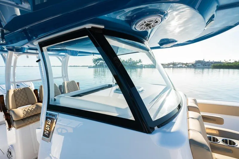 Slide: The Image of 2027 Sportsman Open 352 Center Console boat with sleek design on calm water. - 38