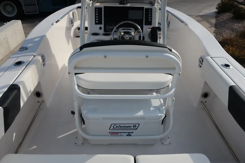 Slide: The Image of 2023 Robalo R202 Explorer boat interior with steering console and seating. - 23