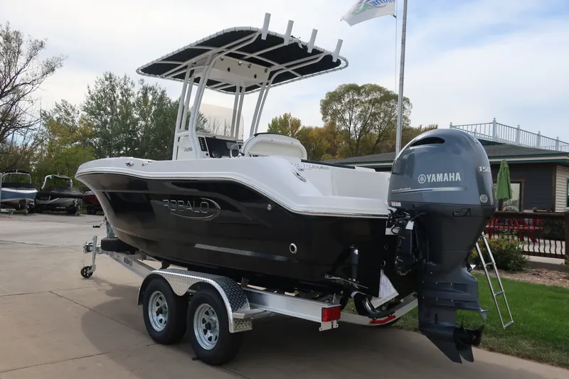 Slide: The Image of 2023 Robalo R202 Explorer boat with Yamaha engine on trailer, parked outdoors. - 5