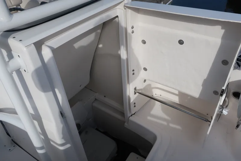 Slide: The Image of 2023 Robalo R202 Explorer boat interior storage compartment, open and spacious design. - 12