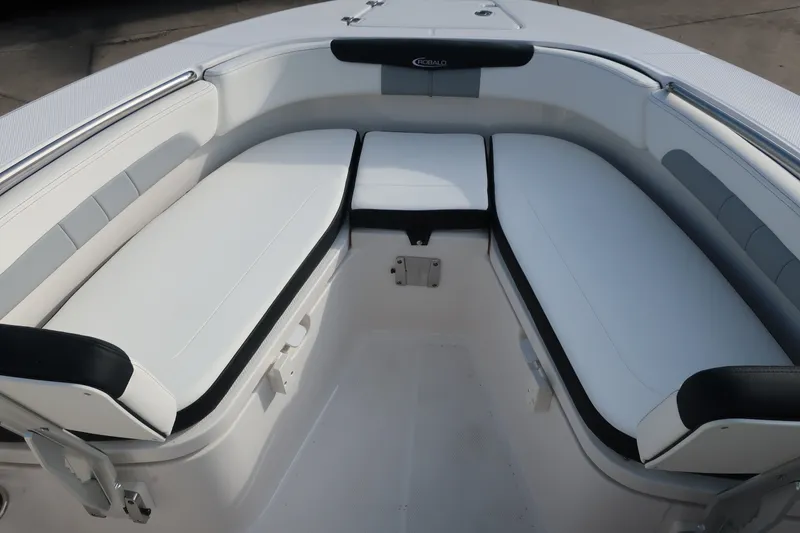 Slide: The Image of 2023 Robalo R202 Explorer boat interior with cushioned seating. - 28