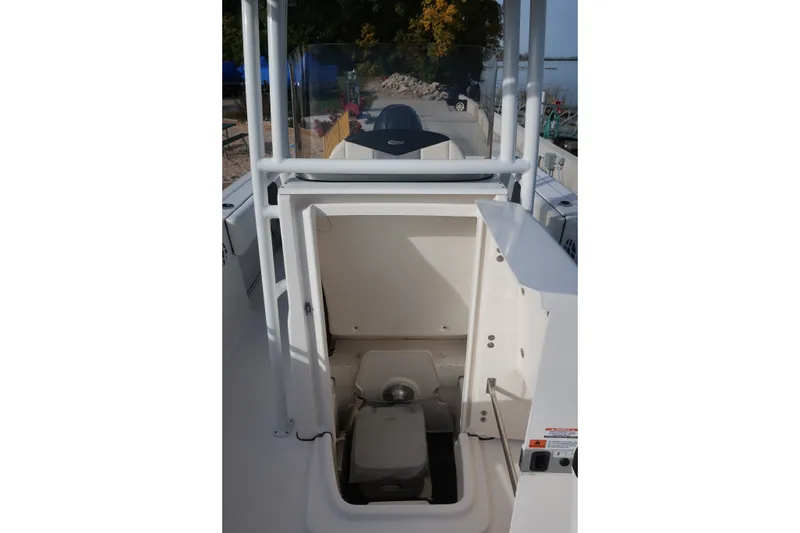 Slide: The Image of 2023 Robalo R202 Explorer boat with open storage compartment. - 13