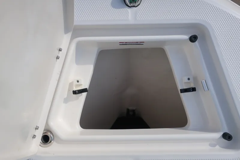 Slide: The Image of Open storage compartment on 2023 Robalo R202 Explorer boat. - 10