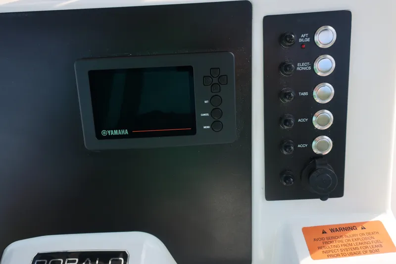 Slide: The Image of Control panel of 2023 Robalo R202 Explorer boat with Yamaha display and switches. - 18