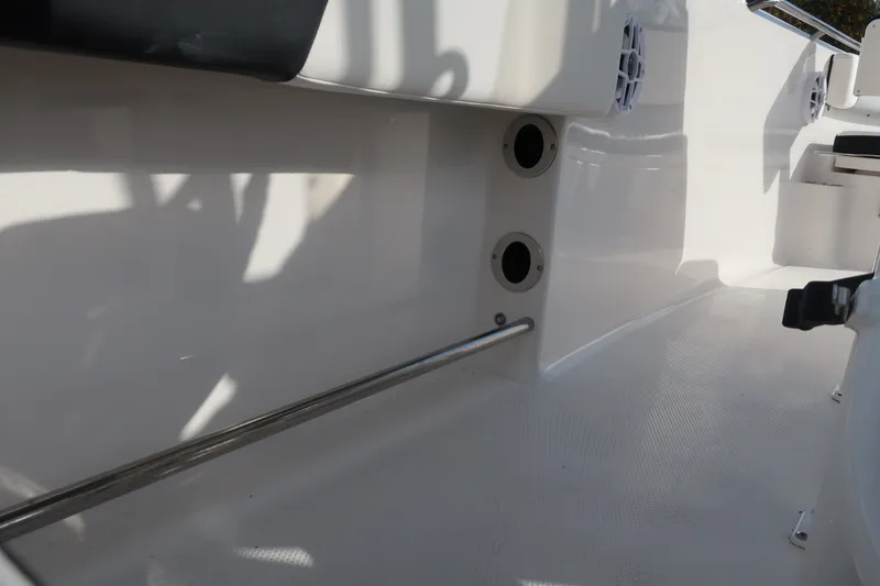 Slide: The Image of 2023 Robalo R202 Explorer interior detail with stainless steel railing and speaker system. - 20