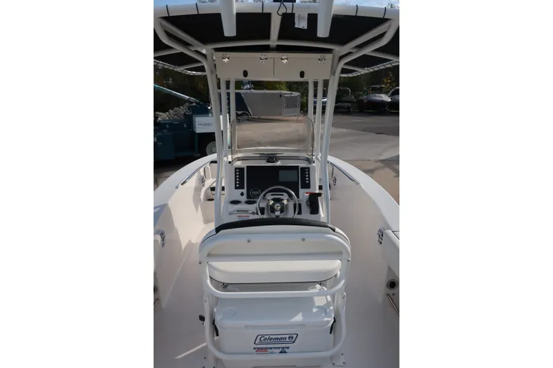 Slide: The Image of 2023 Robalo R202 Explorer boat interior with steering console and seating. - 24