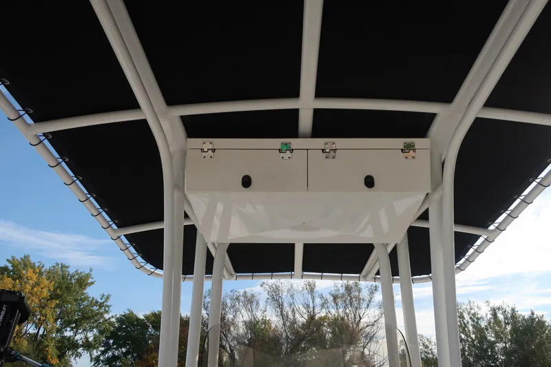 Slide: The Image of 2023 Robalo R202 Explorer boat canopy with storage compartment, viewed from below. - 25