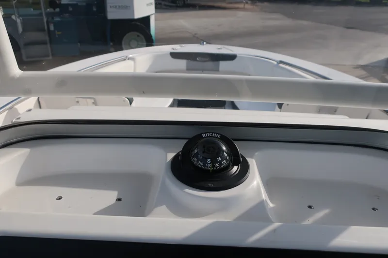 Slide: The Image of 2023 Robalo R202 Explorer boat dashboard with Ritchie compass. - 22