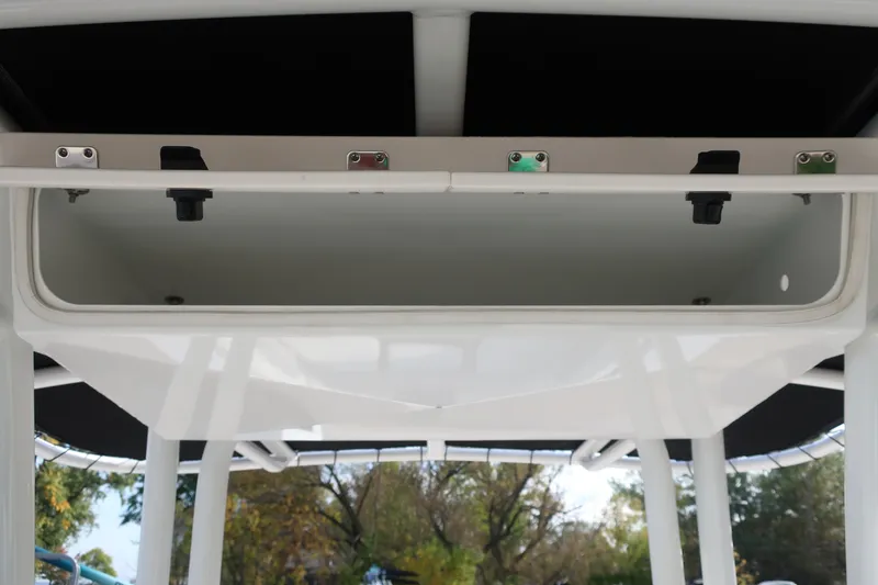 Slide: The Image of 2023 Robalo R202 Explorer boat storage compartment, open view, showcasing interior space. - 26