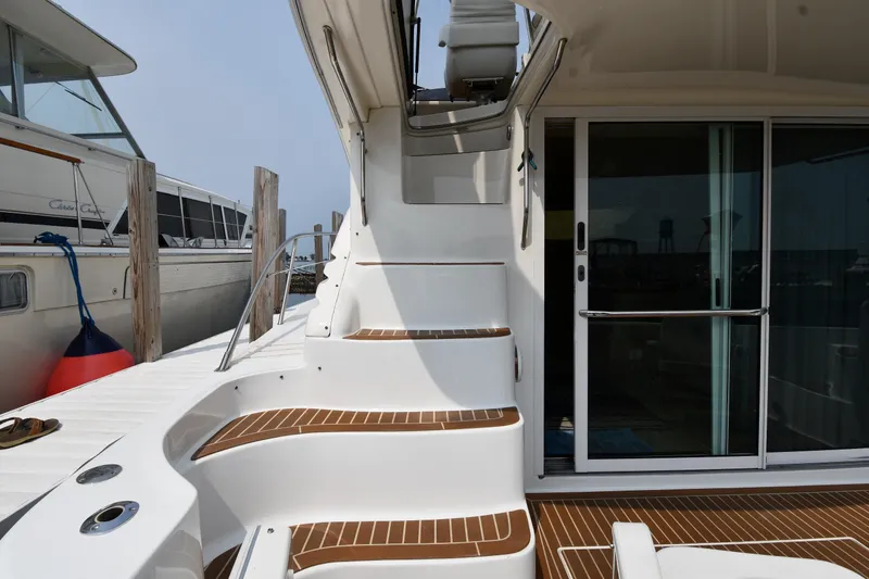 Slide: The Image of Staircase and sliding door on 1998 Sea Ray 400 Sedan Bridge yacht. - 14