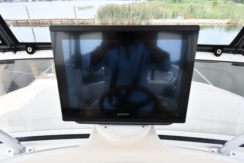Slide: The Image of Garmin display on 1998 Sea Ray 400 Sedan Bridge yacht, with scenic water view. - 23