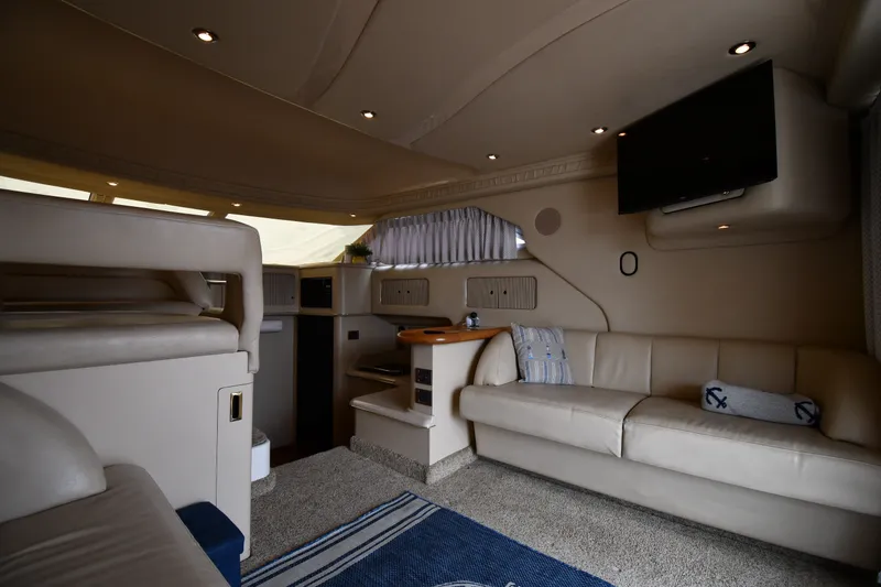 Slide: The Image of Luxurious interior of a 1998 Sea Ray 400 Sedan Bridge yacht with plush seating and modern amenities. - 40
