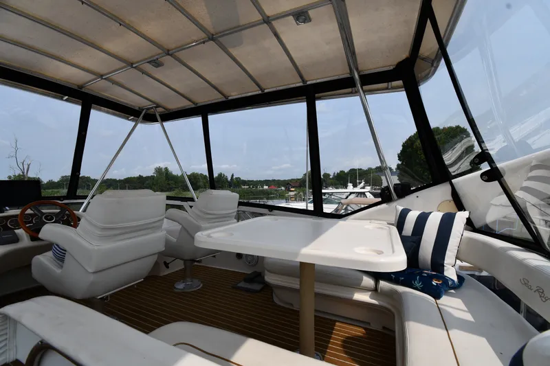 Slide: The Image of Interior view of 1998 Sea Ray 400 Sedan Bridge yacht with seating and table. - 16
