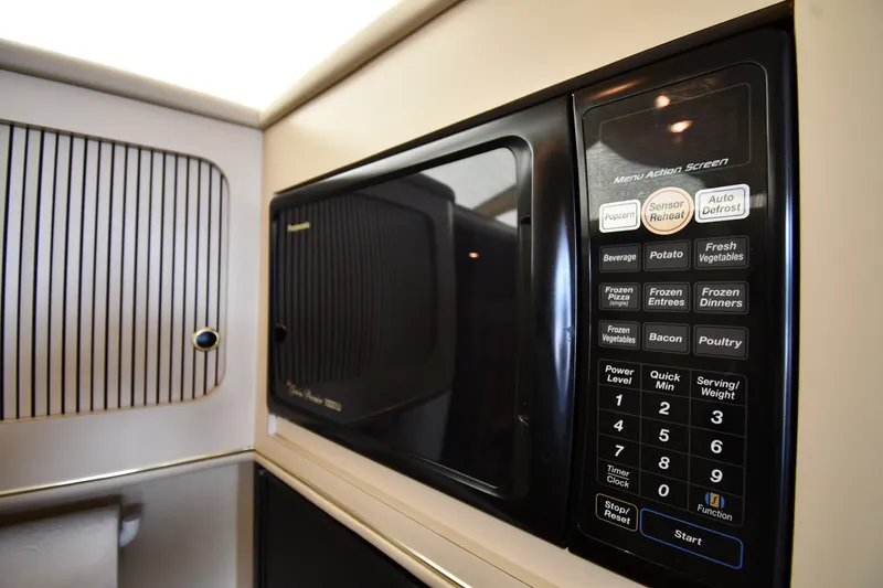 Slide: The Image of Microwave in 1998 Sea Ray 400 Sedan Bridge yacht kitchen interior. - 48