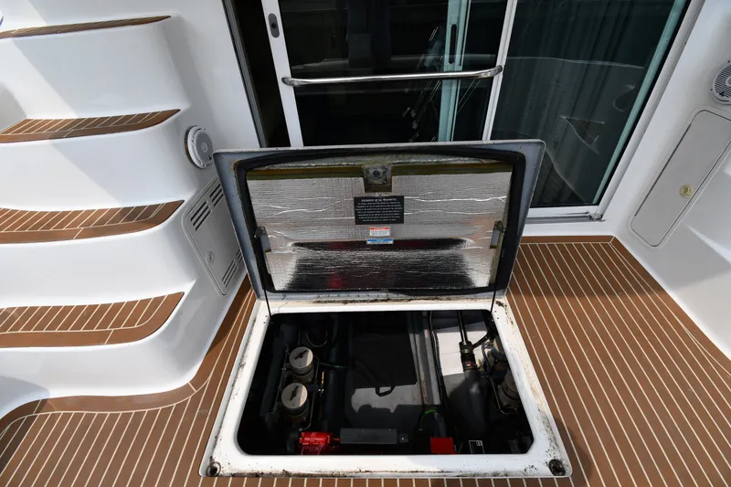 Slide: The Image of Open engine compartment on 1998 Sea Ray 400 Sedan Bridge yacht deck. - 56