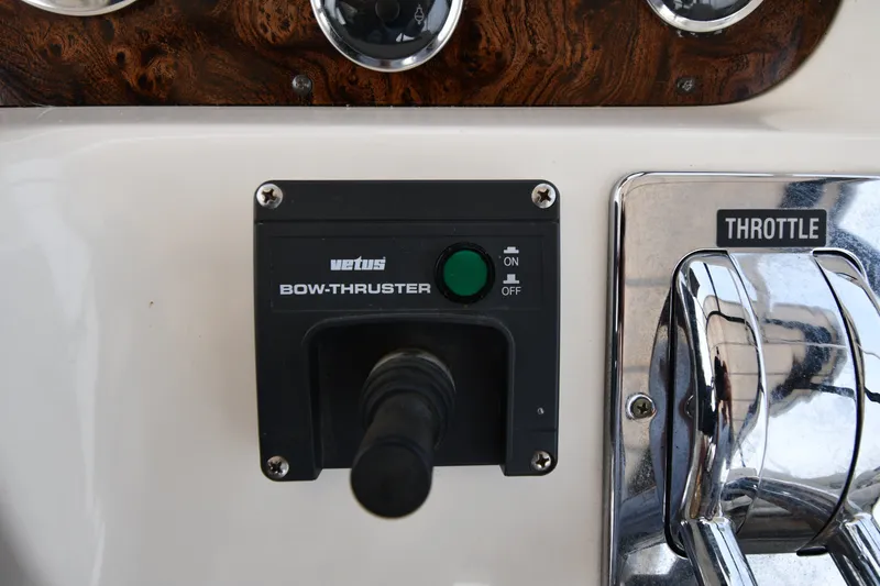 Slide: The Image of Control panel of 1998 Sea Ray 400 Sedan Bridge with bow thruster and throttle. - 24