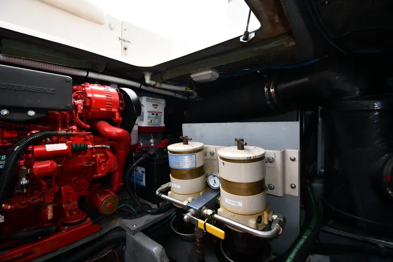 Slide: The Image of Engine room of 1998 Sea Ray 400 Sedan Bridge with visible machinery and components. - 61