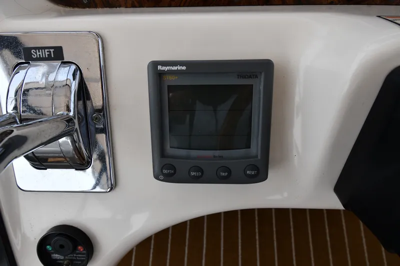 Slide: The Image of Control panel of a 1998 Sea Ray 400 Sedan Bridge with Raymarine ST60+ display. - 22