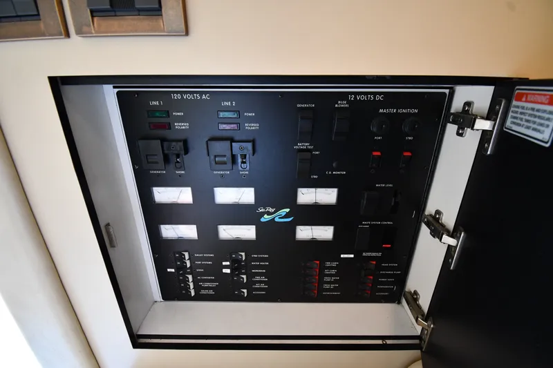 Slide: The Image of Electrical control panel on a 1998 Sea Ray 400 Sedan Bridge yacht. - 51