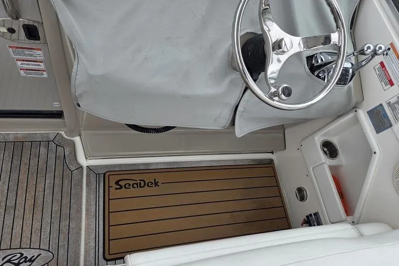 Slide: The Image of 2008 Sea Ray 290 Amberjack helm with covered steering wheel and SeaDek flooring. - 19