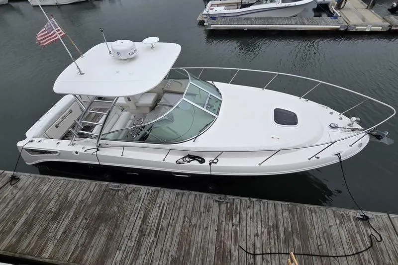 Slide: The Image of 2008 Sea Ray 290 Amberjack boat docked at marina, aerial view. - 2