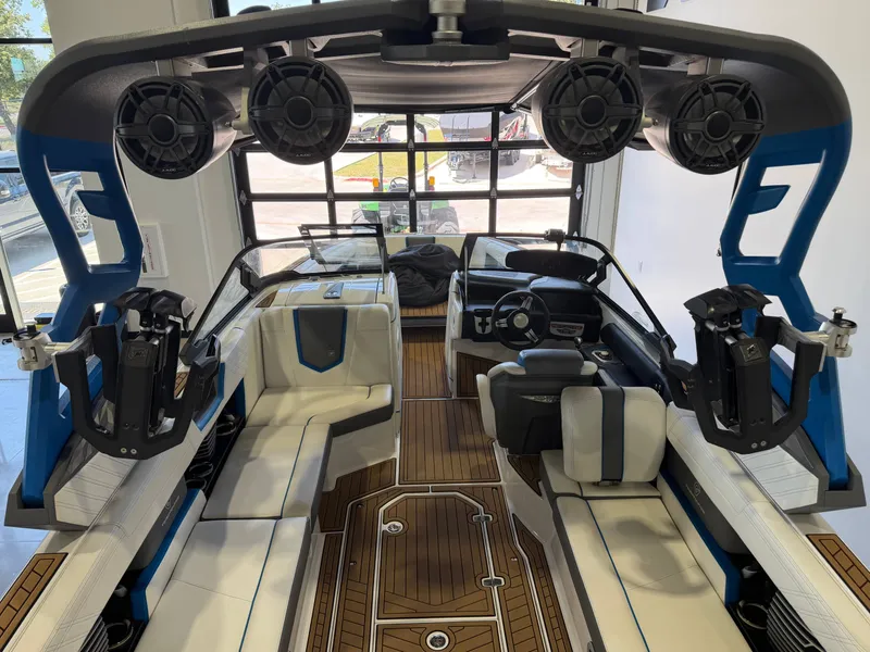 Slide: The Image of The image shows the interior of a 2019 Nautique Super Air Nautique G25 with modern seating and speakers. - 6