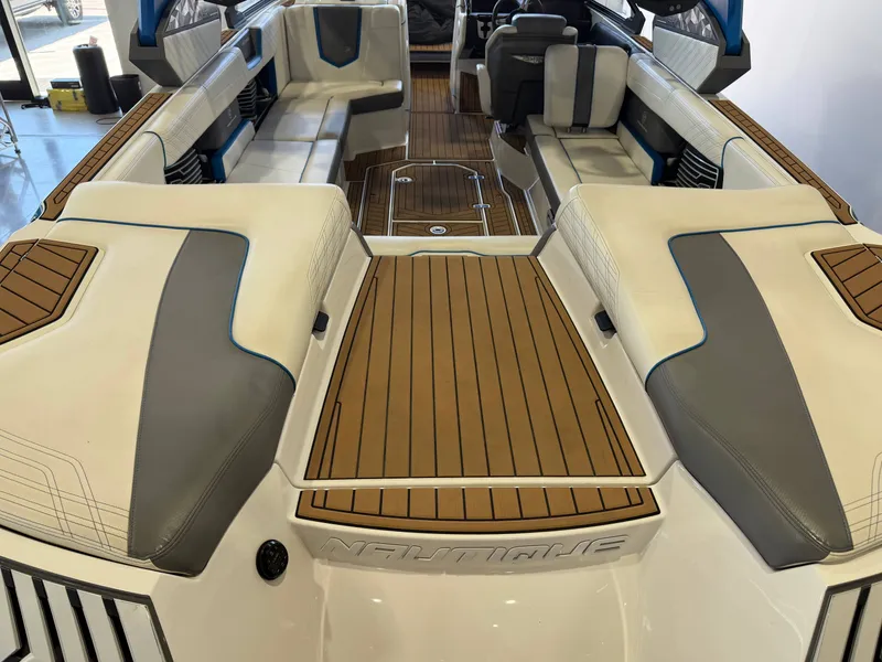 Slide: The Image of The image shows the spacious cockpit of a 2019 Nautique Super Air Nautique G25 with sleek seating. - 5