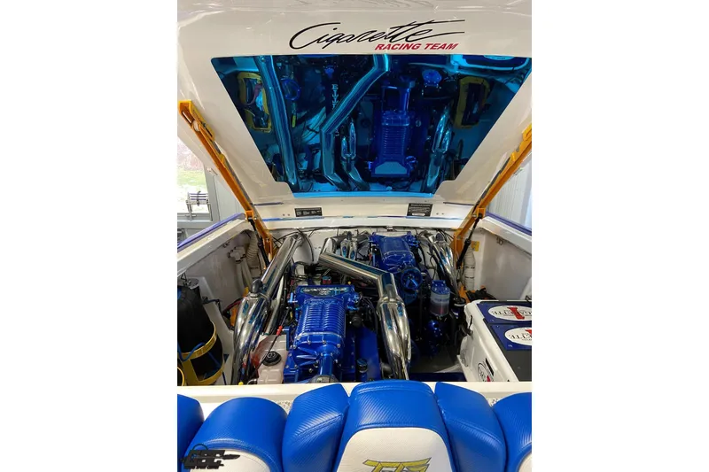 Slide: The Image of Engine compartment of a 2005 Cigarette 39' Top Gun Unlimited boat, showcasing powerful machinery. - 20