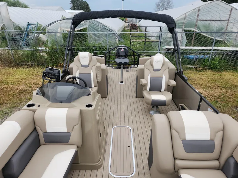 Slide: The Image of The image shows a 2023 SunChaser Eclipse 8523 LR DH pontoon boat with beige and white seating. - 7