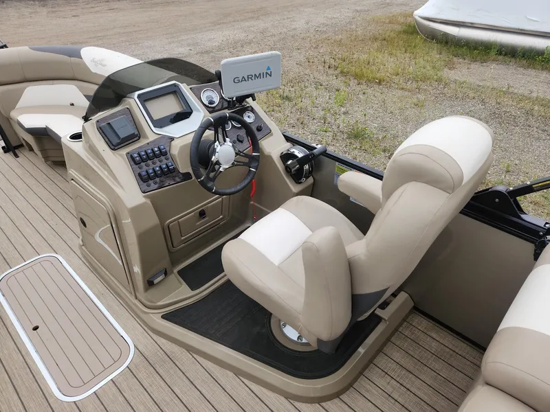 Slide: The Image of The image shows the cockpit of a 2023 SunChaser Eclipse 8523 LR DH with a Garmin display. - 12