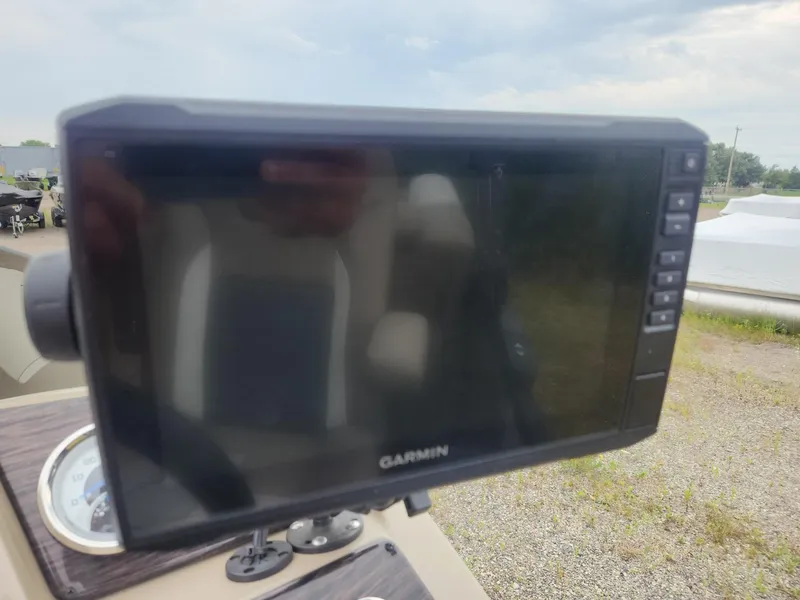 Slide: The Image of A Garmin screen on a boat, surrounded by a cloudy sky and gravel ground. - 15