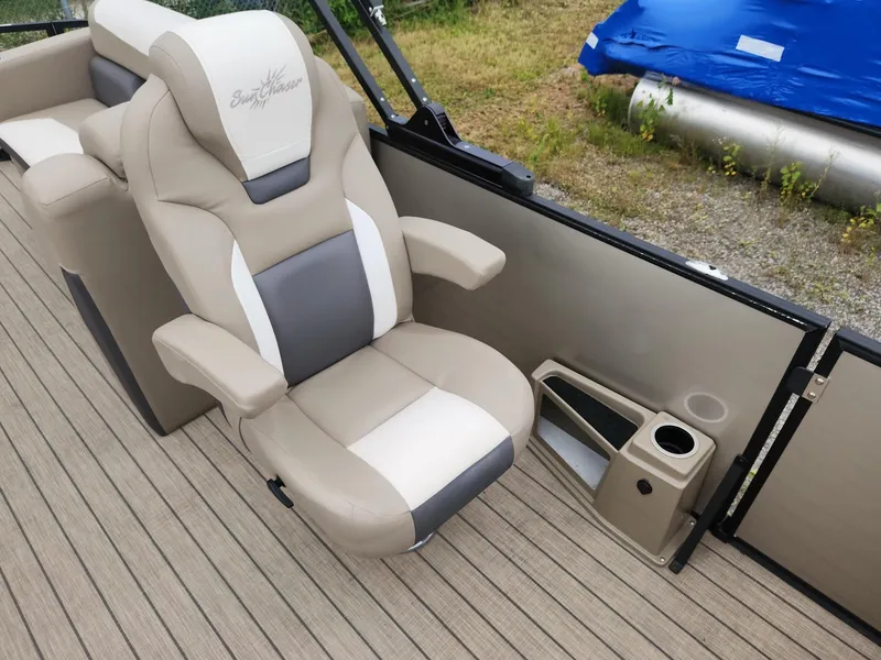 Slide: The Image of A luxurious, padded captain's chair on a SunChaser pontoon boat, featuring a cup holder and modern design. - 17