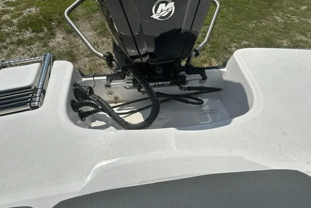 Slide: The Image of 2022 Tahoe T16 boat motor area with SeaStar hydraulic steering system. - 23