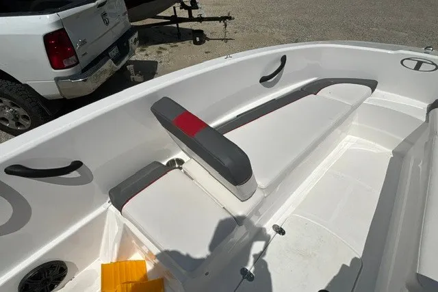 Slide: The Image of 2022 Tahoe T16 boat interior with white seating and red accents. - 19