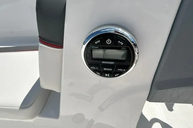 Slide: The Image of Control panel of a 2022 Tahoe T16 boat featuring a Kicker audio system. - 24