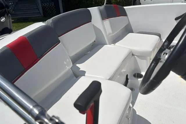 Slide: The Image of Interior of a 2022 Tahoe T16 boat with white and gray seating. - 16