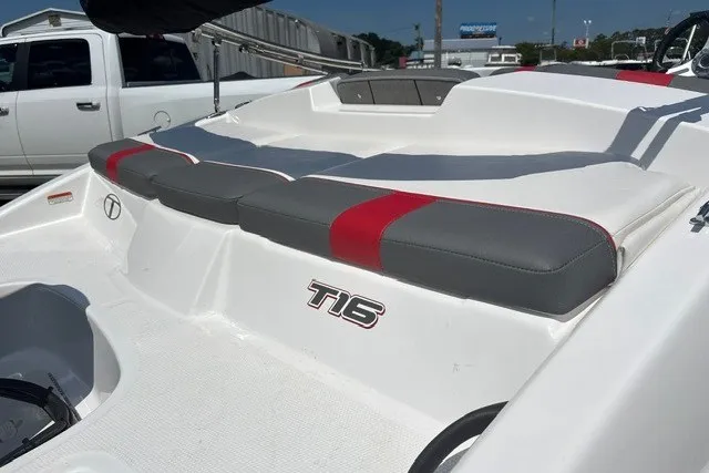 Slide: The Image of 2022 Tahoe T16 boat with cushioned seating and sleek design. - 15