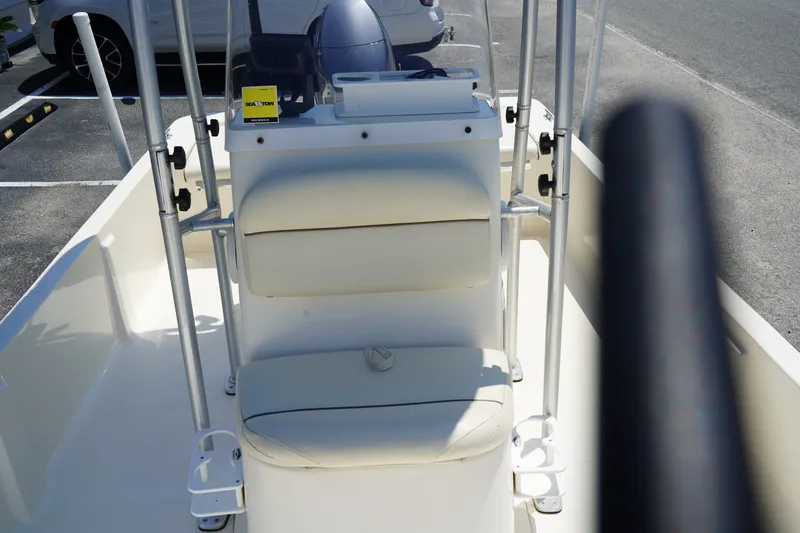 Slide: The Image of 2015 Key West 197 Skiff boat interior with seating and steering console. - 6