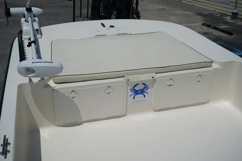 Slide: The Image of 2015 Key West 197 Skiff boat deck with storage compartments and trolling motor. - 5