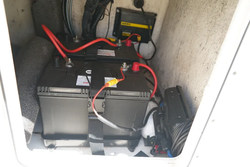 Slide: The Image of Battery compartment of a 2015 Key West 197 Skiff with wiring and connections. - 9