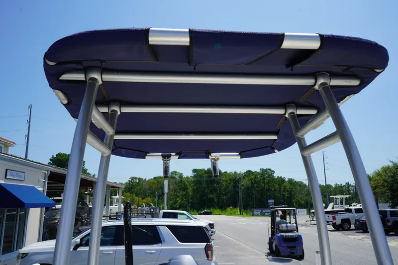 Slide: The Image of 2015 Key West 197 Skiff T-top view with aluminum frame and blue canvas. - 11