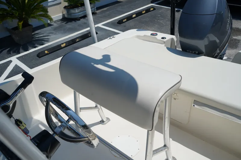 Slide: The Image of 2015 Key West 197 Skiff boat interior with steering wheel and seating. - 7