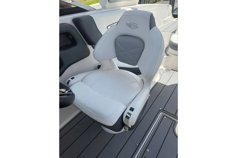 Slide: The Image of 2020 Chaparral 257 SSX boat seat with sleek white and gray design. - 13