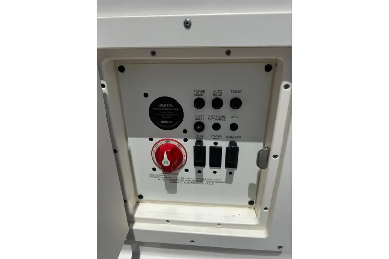 Slide: The Image of Control panel of a 2020 Chaparral 257 SSX boat with switches and a red dial. - 27
