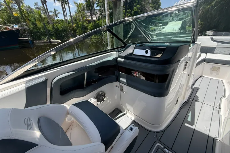 Slide: The Image of 2020 Chaparral 257 SSX boat interior with sleek seating and modern dashboard design. - 20