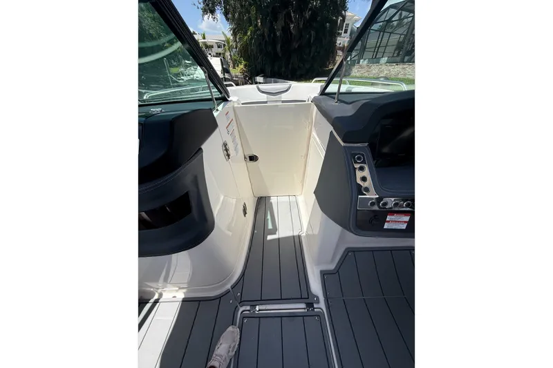 Slide: The Image of 2020 Chaparral 257 SSX boat interior with sleek design and modern controls. - 8